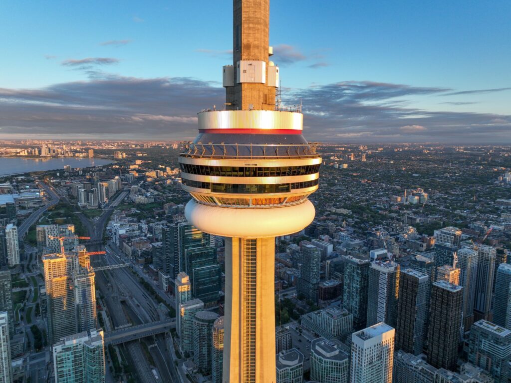 closeup of the cn tower, downtown toronto from an aerial view